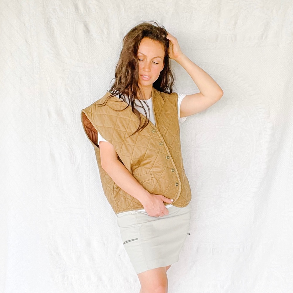Quilted Ducks Unlimited olive + saddle brown vest. Measures L/XL.